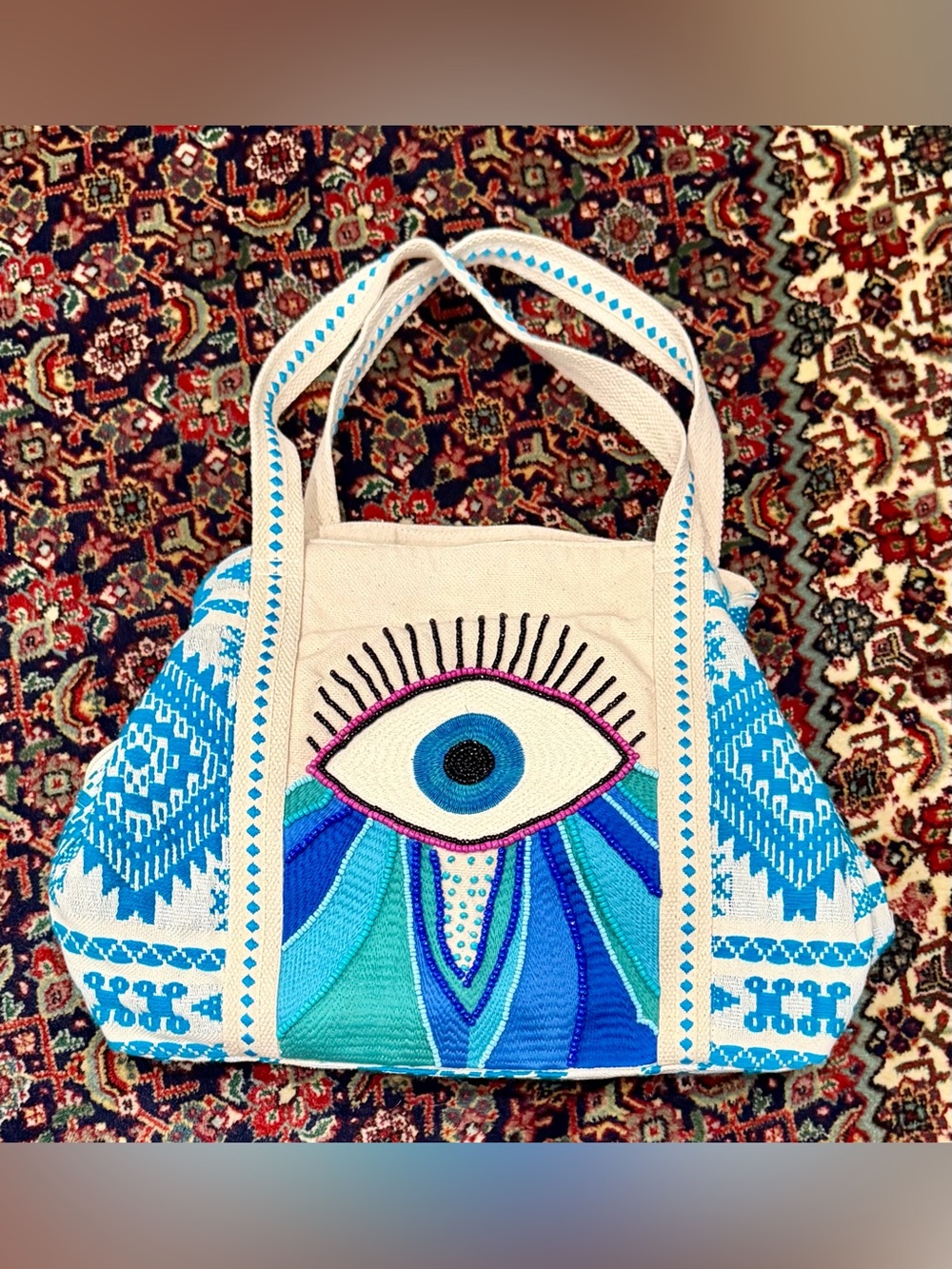 EVIL EYE TOTE BAG EMBROIDERED ZIP TOP /LINED POCKETS.